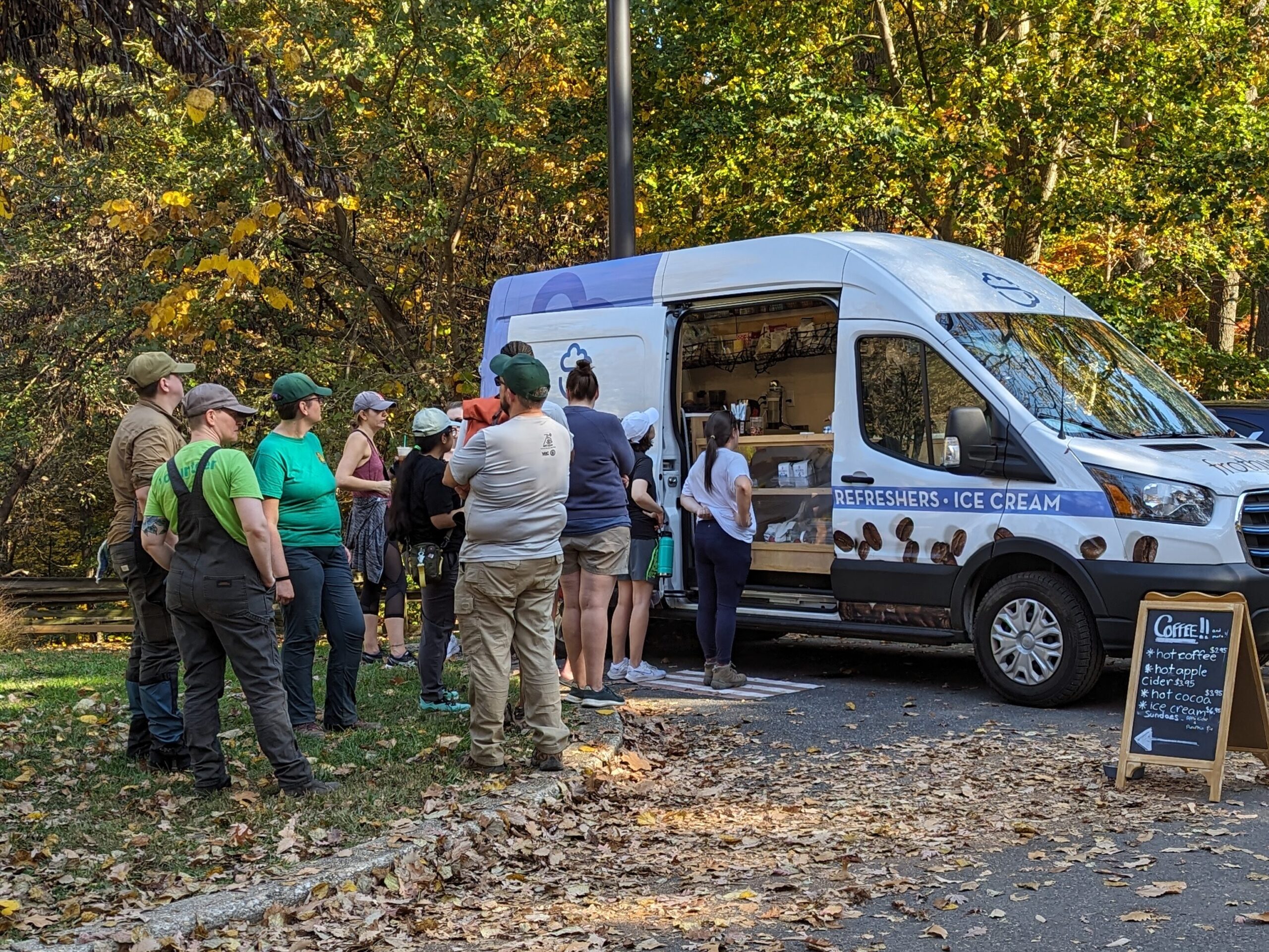 People lined up outside of frothy van